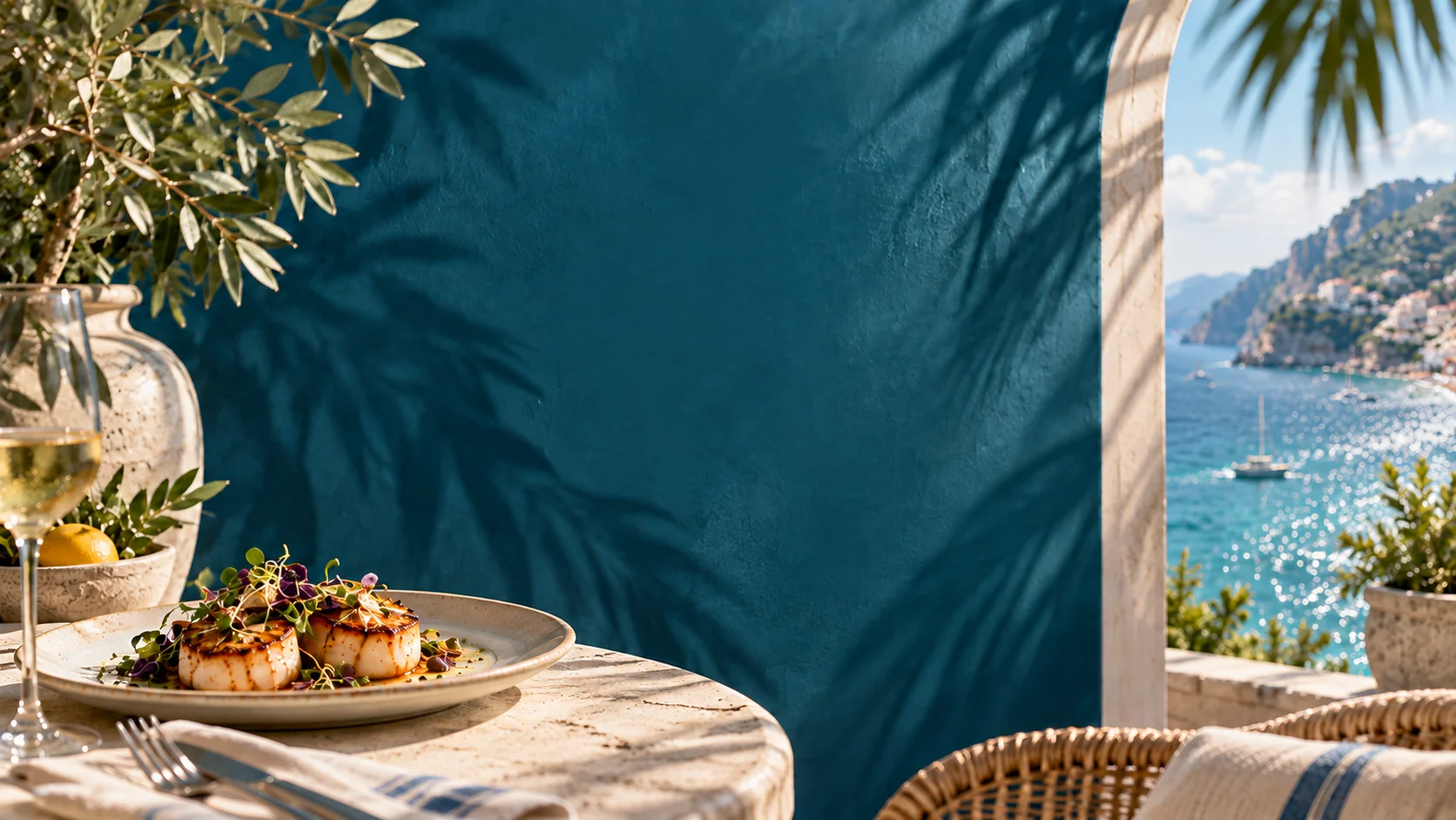 Luna's coastal brand artwork with teal walls and warm table settings
